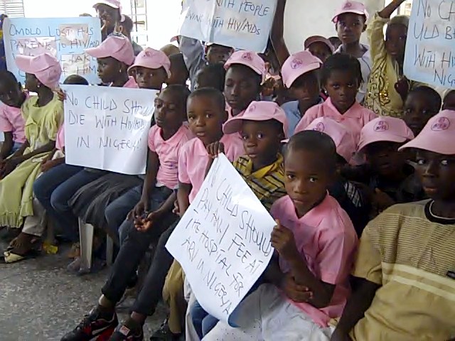 SOWCHAN presents school uniforms, bags and shoes to OVC in Lagos during Children's Day celebration. Supported by Chevron Nigeria and AWDF.