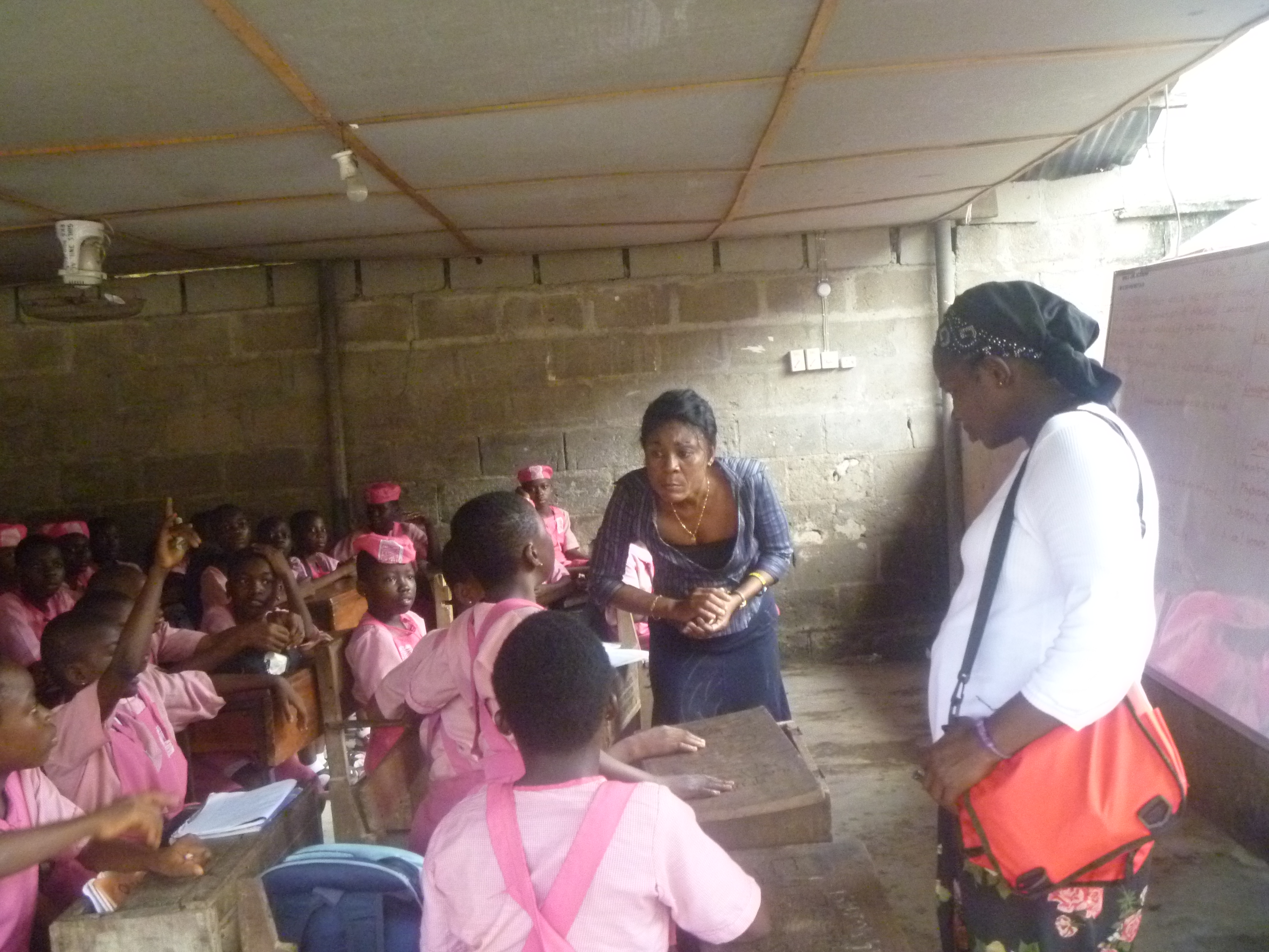 SOWCHAN trained volunteers teaching in-school girls on sexual and reproductive health.
